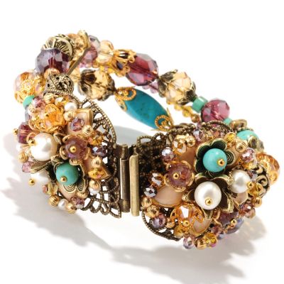GOLDTONE MULTI STRAND FLOWER CENTER BRACELET